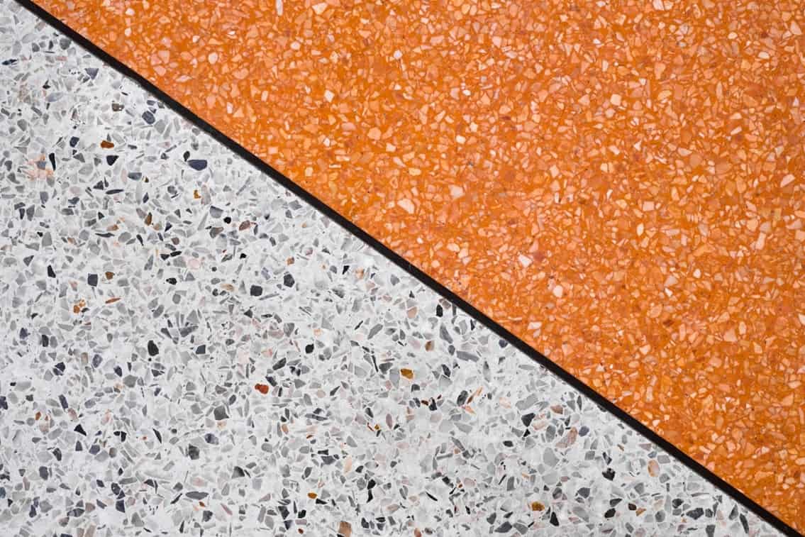 ext: Close up on two samples of polished concrete flooring. The high durability and low maintenance of polished concrete makes it one of the best flooring options for your business.